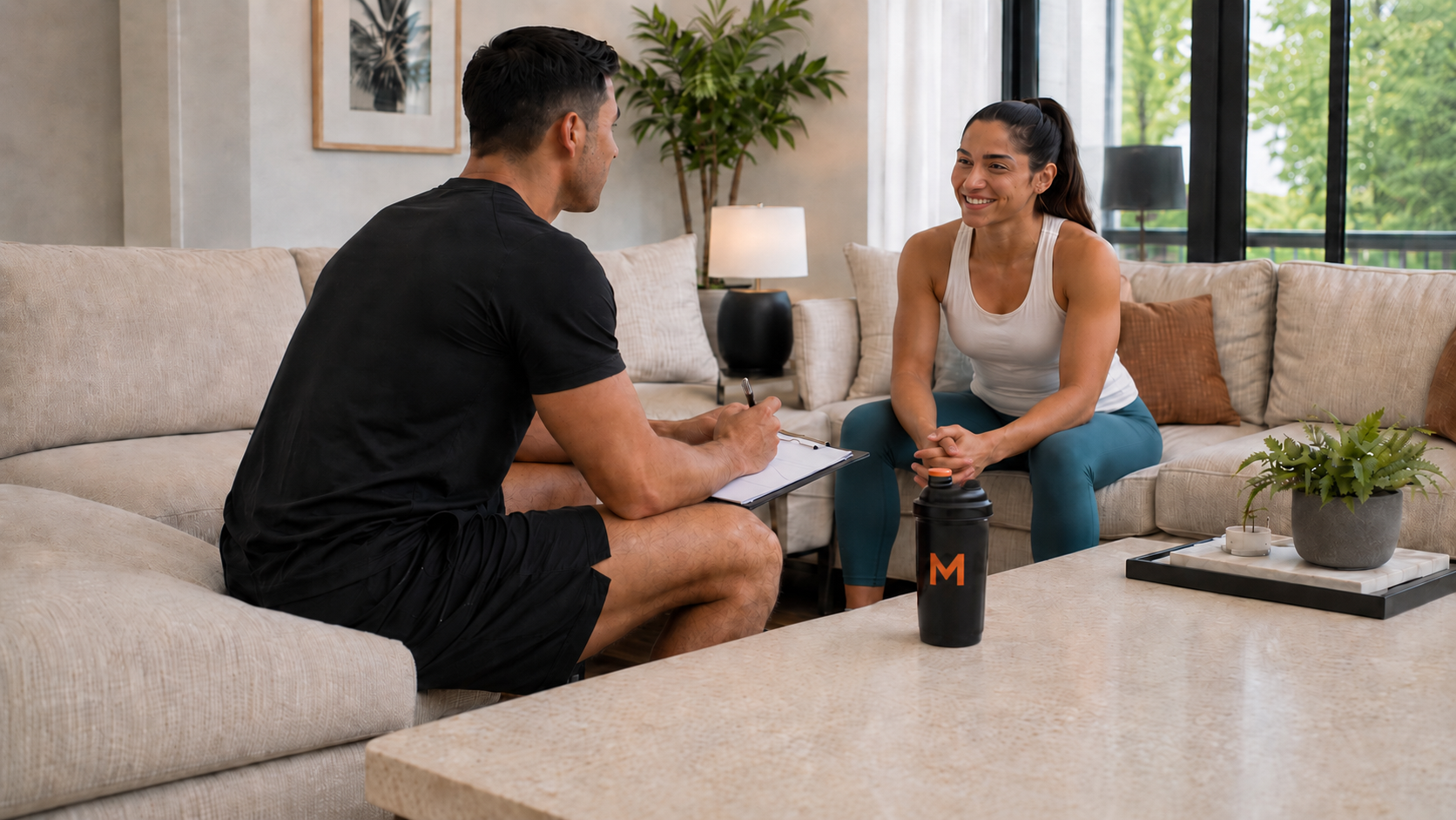 Trainer consulting with client