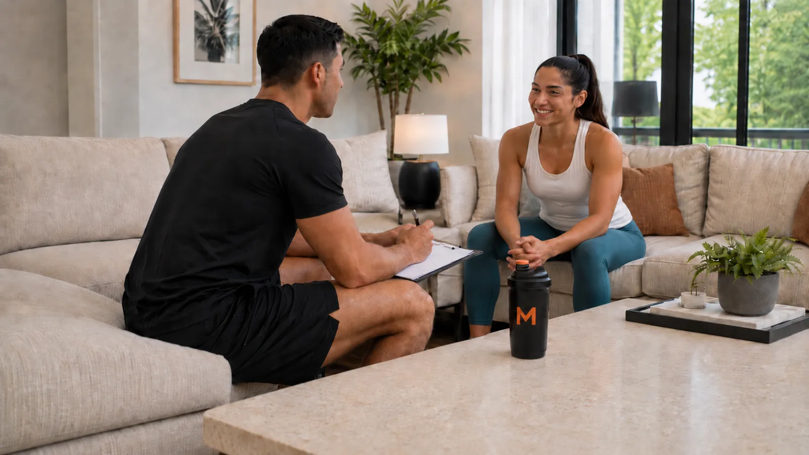 Trainer consulting with client